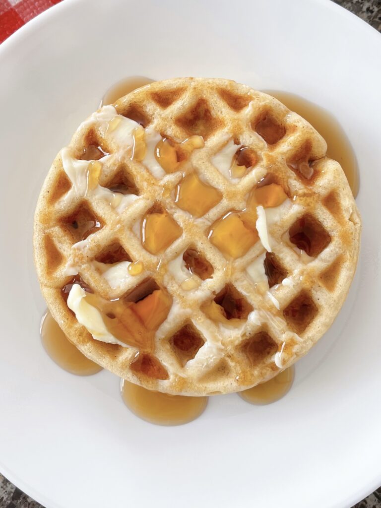 A waffle made with pancake mix with butter and syrup.