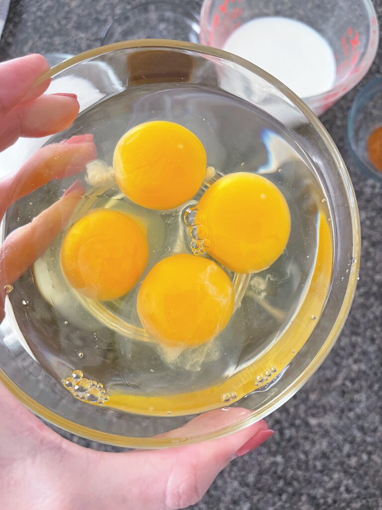 A bowl with four eggs to make French Toast.