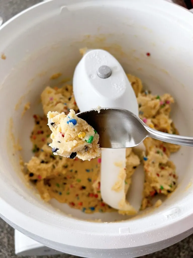 A spoonful of rainbow chip cookie dough.