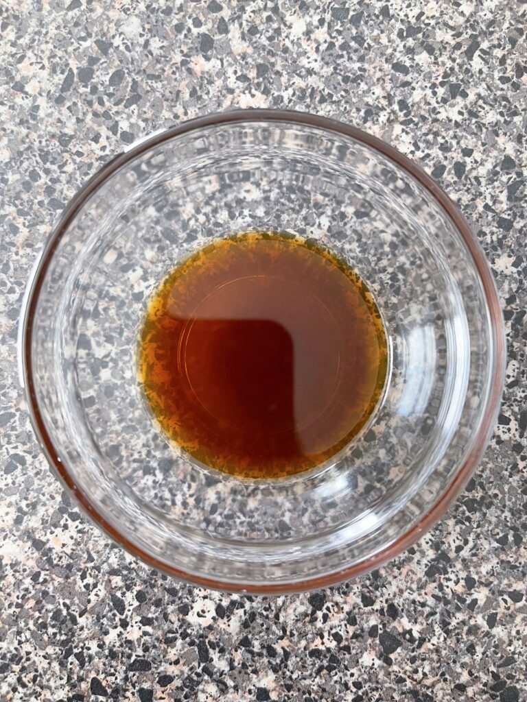 A dish of vanilla extract.