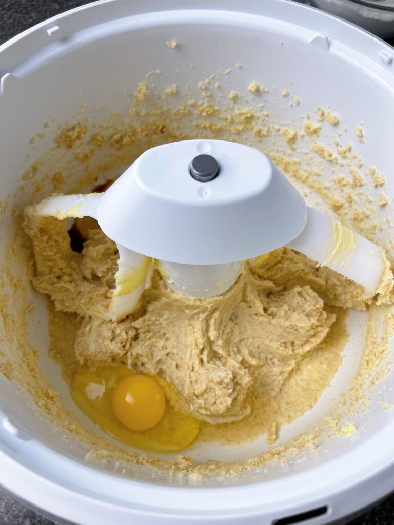 Eggs and vanilla extract added to cookie dough.