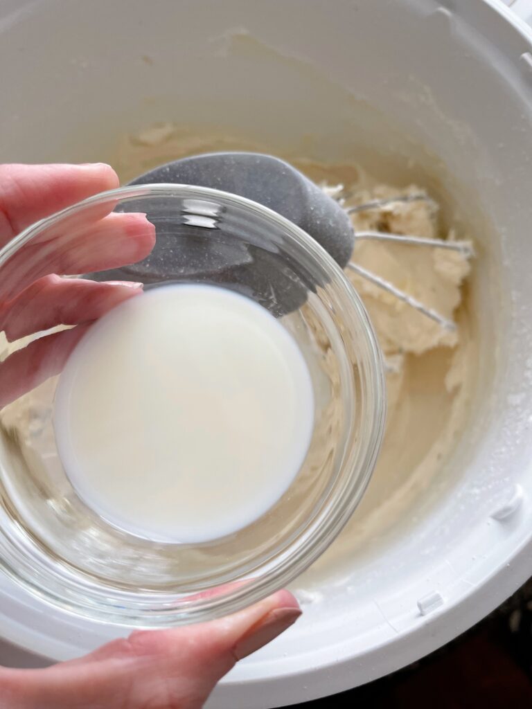 A bowl of milk to add to frosting.