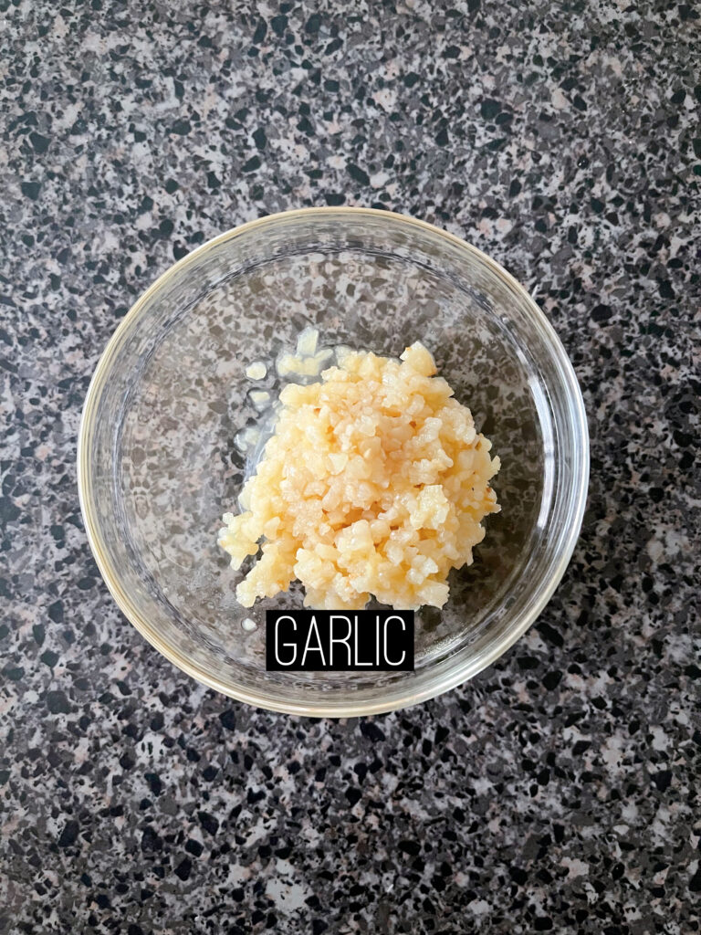 A dish of minced garlic.