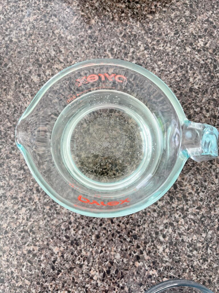 A measuring cup of corn syrup.