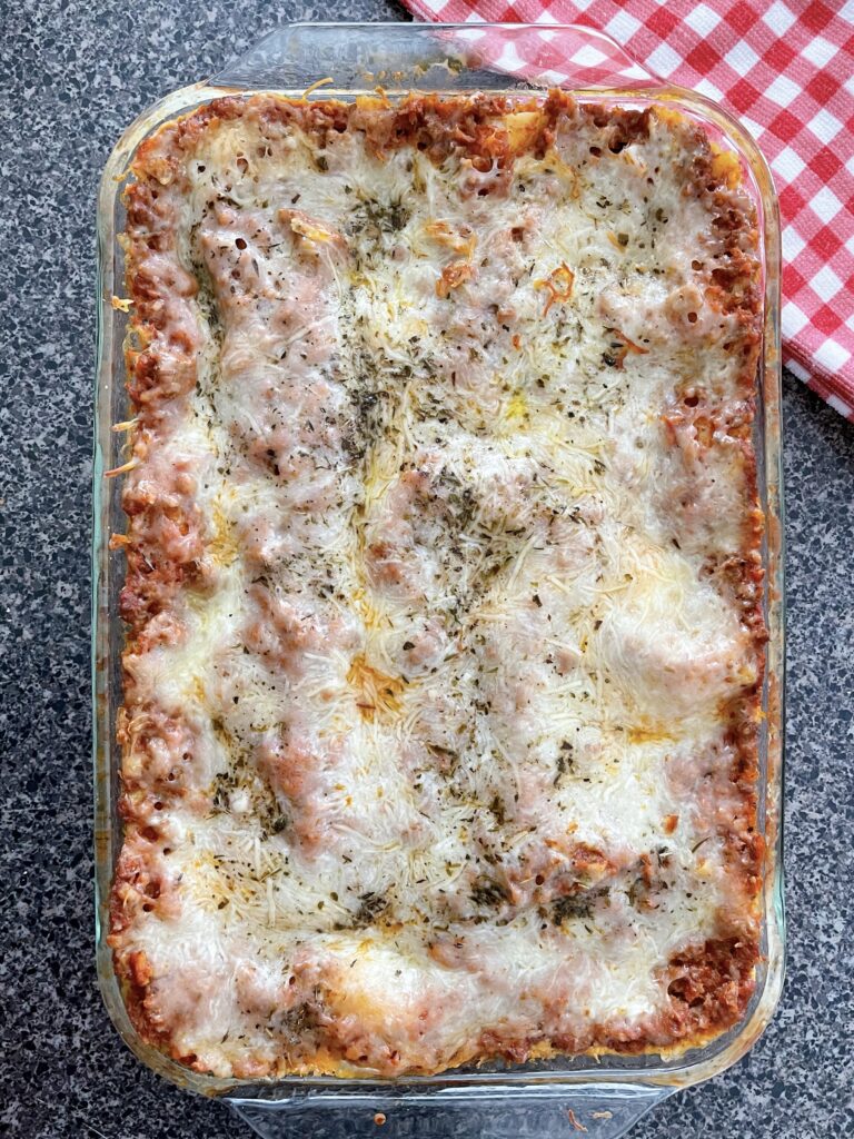 A pan full of lasagna made with ricotta cheese.