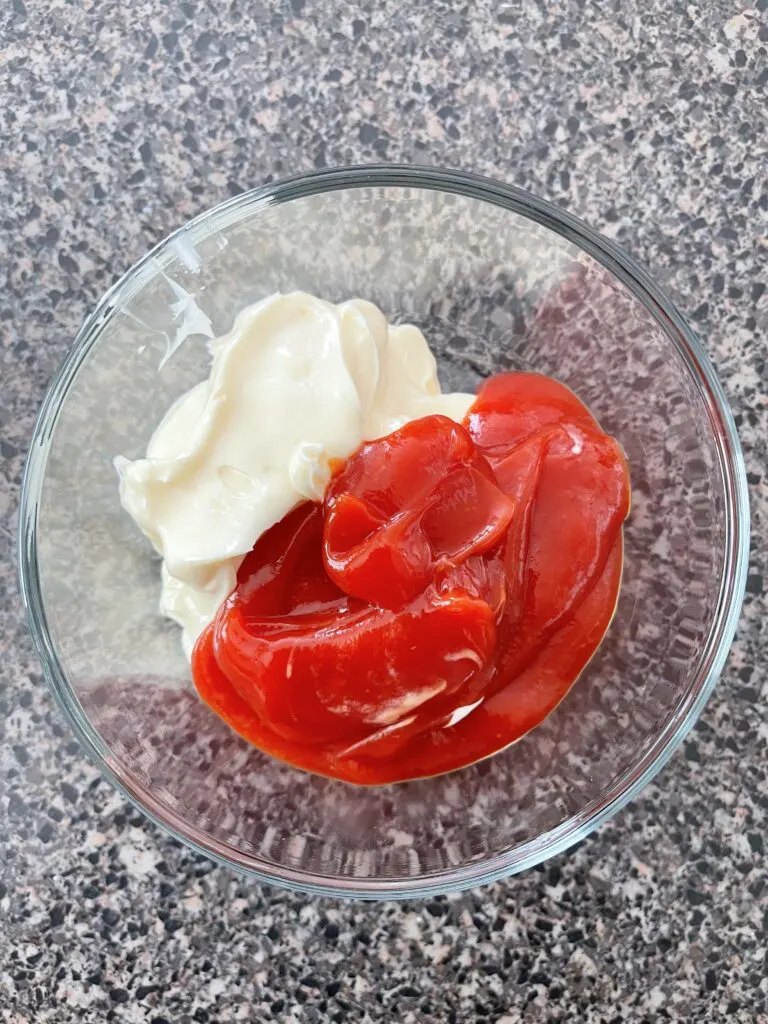 Start with a 50/50 mixture of ketchup and mayonnaise.