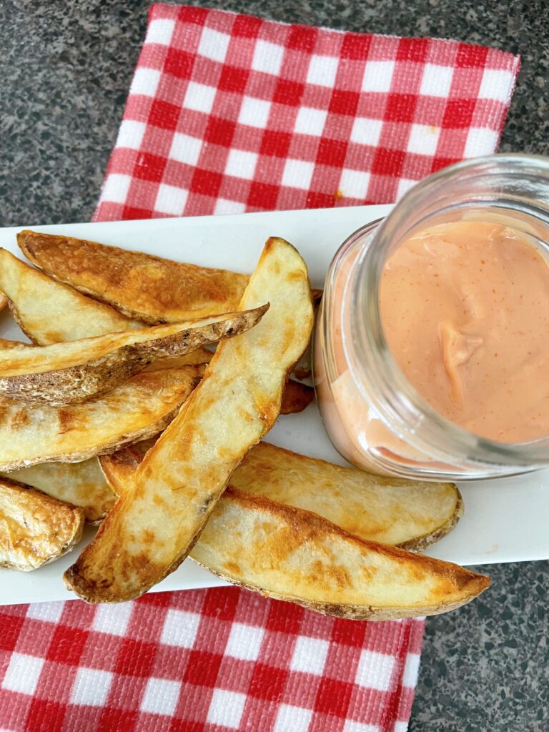 Fries and a jar of fry dipping sauce.