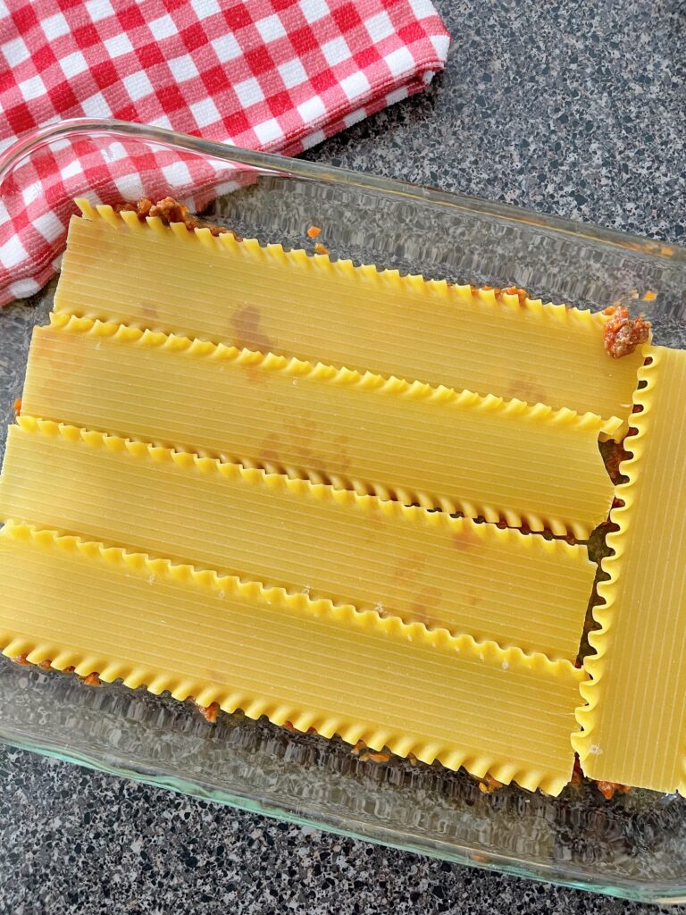 Layers of lasagna noodles in a baking dish.