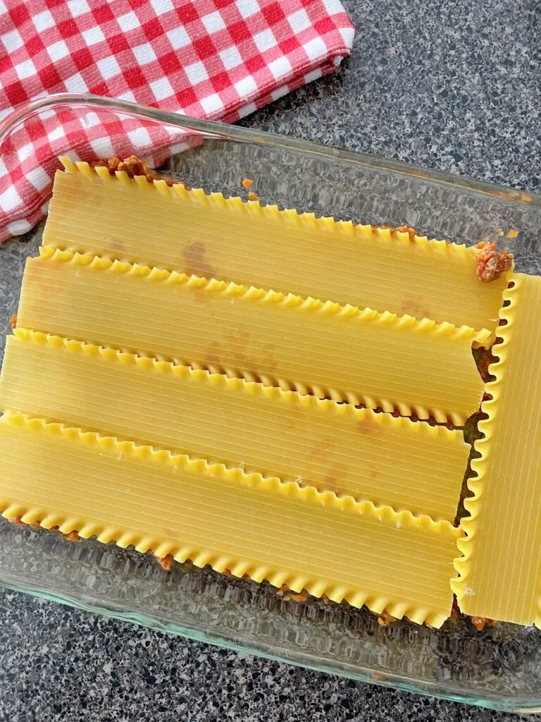 Layers of lasagna noodles in a baking dish.
