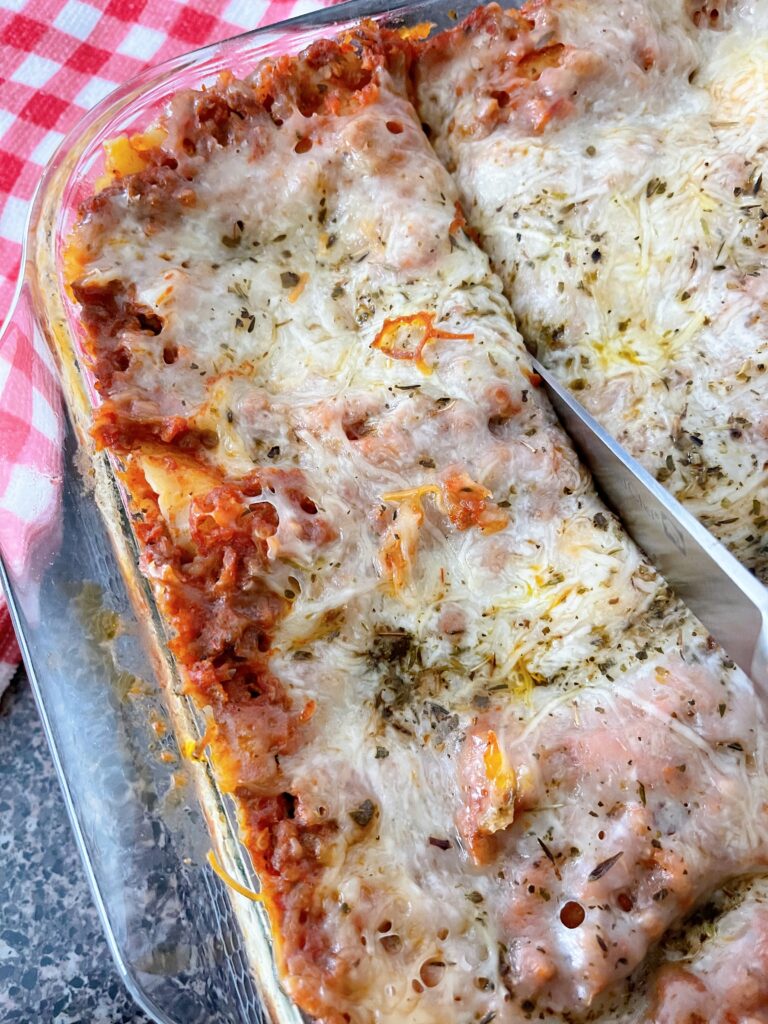 A pan full of lasagna made with ricotta cheese.