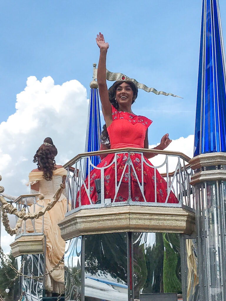 A Disney princess on a parade float at Magic Kingdom.