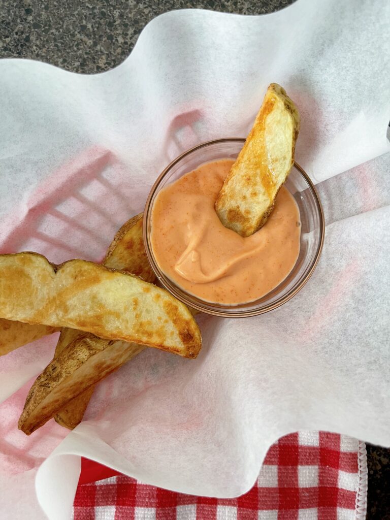 A fry dipped in fry sauce.