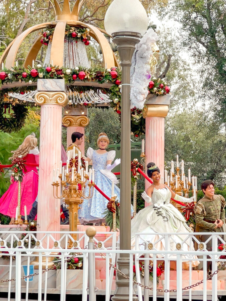 Disney princesses on a float at Disneyland.