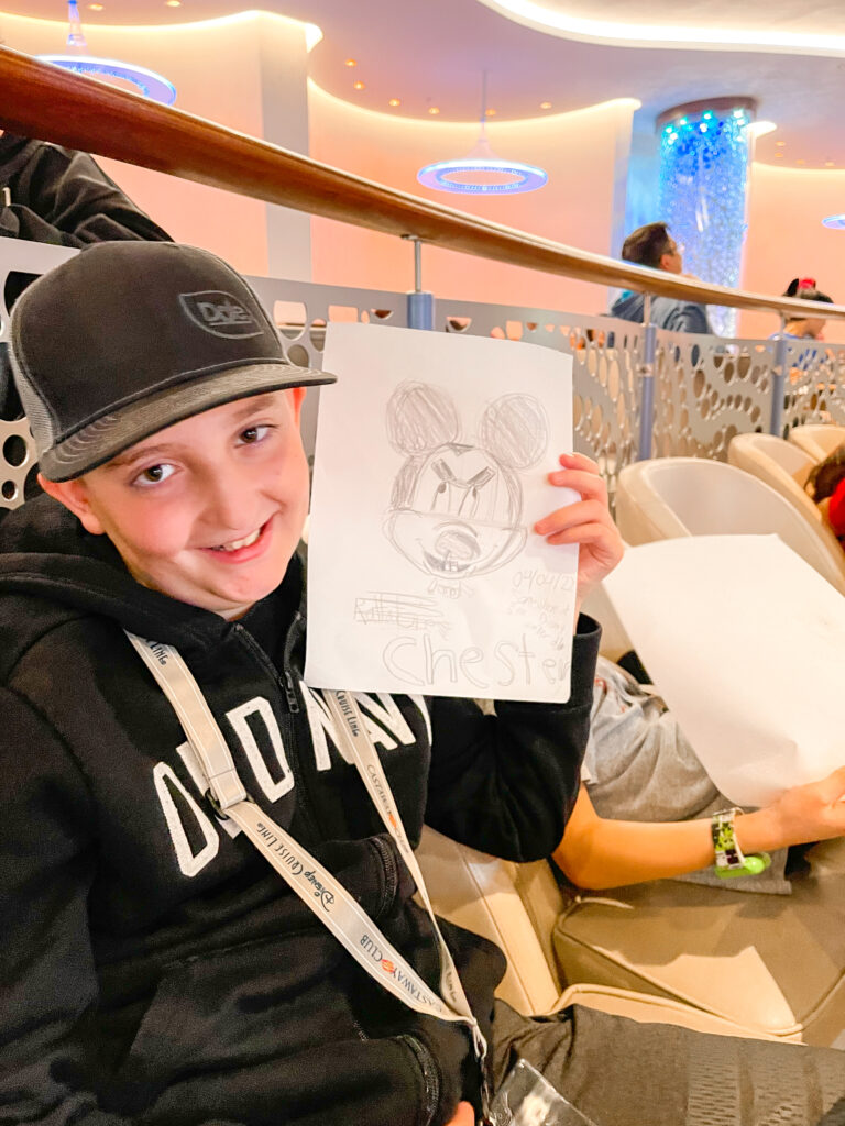 A boy at an animation class on the Disney Wonder.