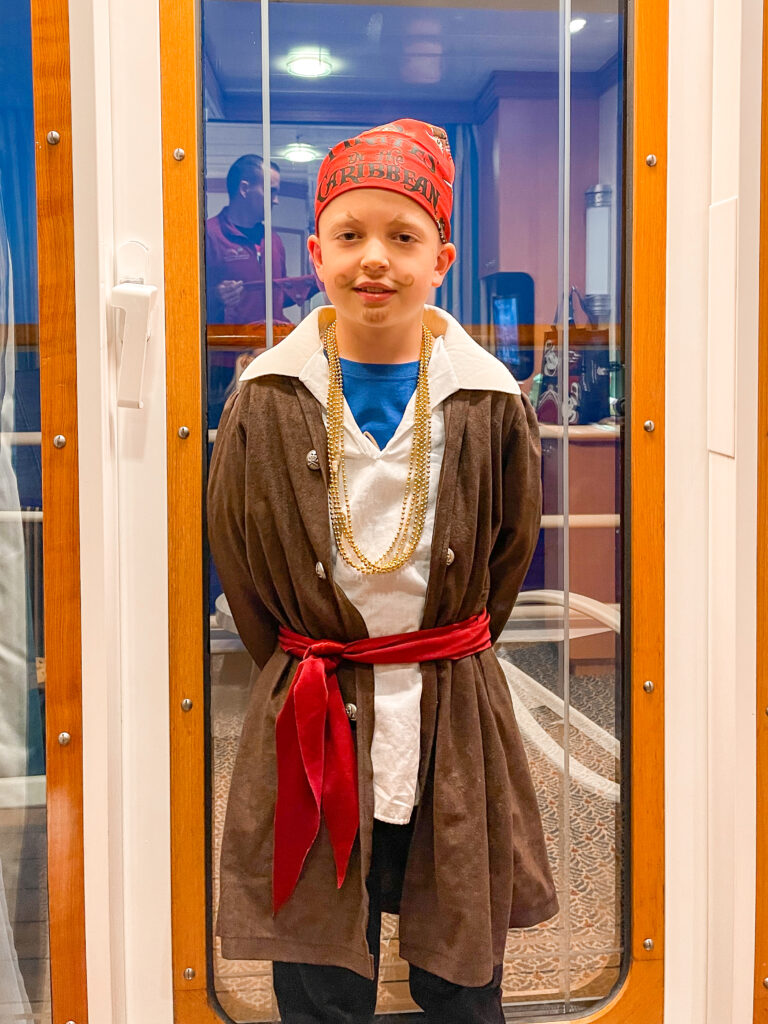 A boy dressed as a pirate for Disney Cruise Pirate Night.