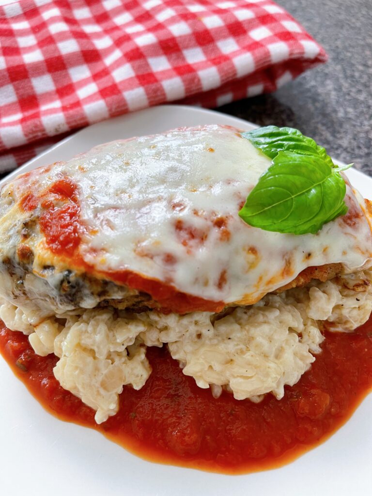 Crispy Chicken Parmesan served over creamy risotto.