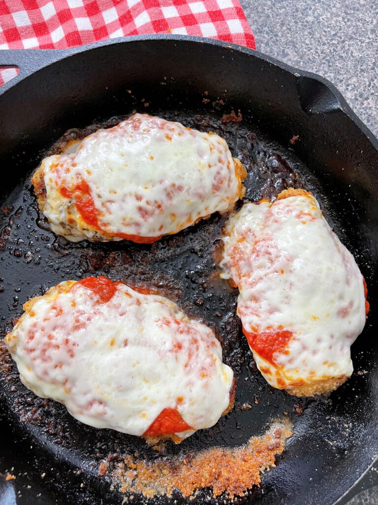 Chicken parmesan in a skillet.