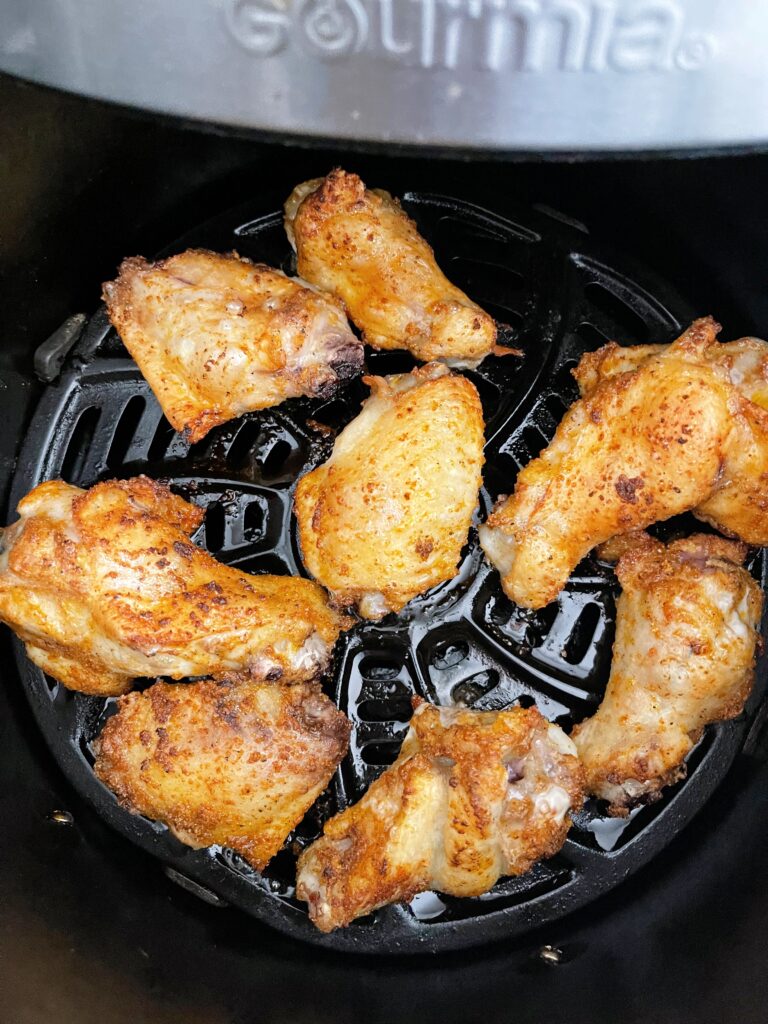 Chicken wings in an air fryer.