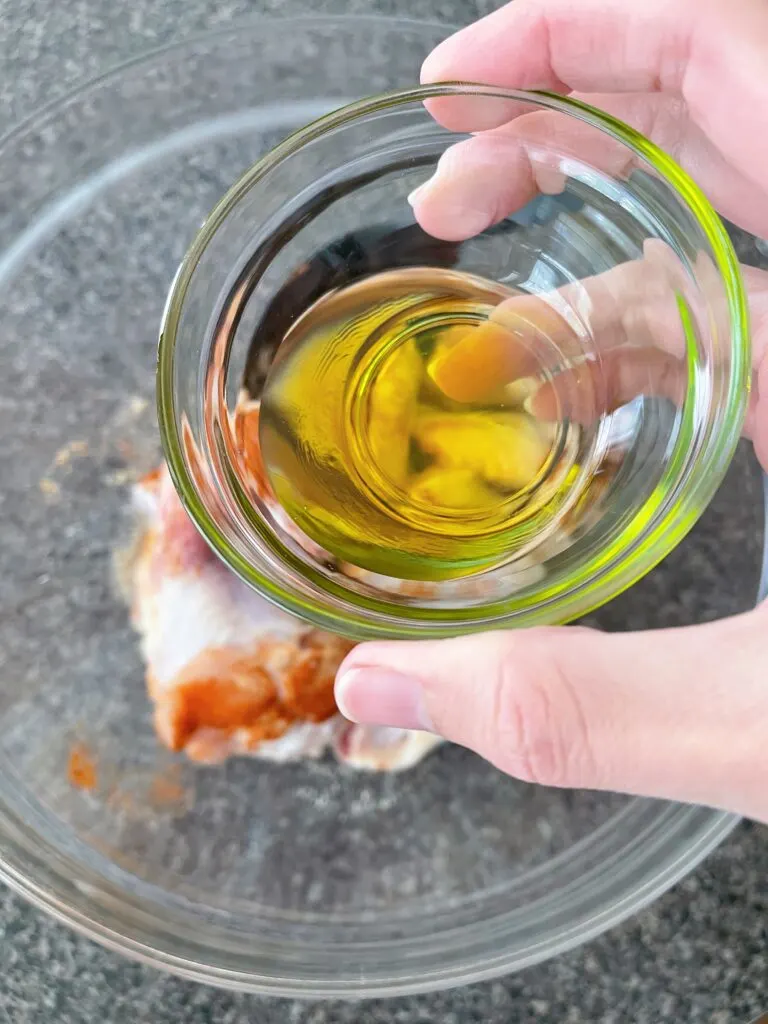 Olive oil drizzled on chicken wings.
