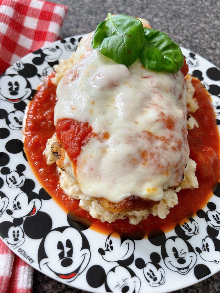 Copycat Palo chicken parmesan on a mickey mouse plate.