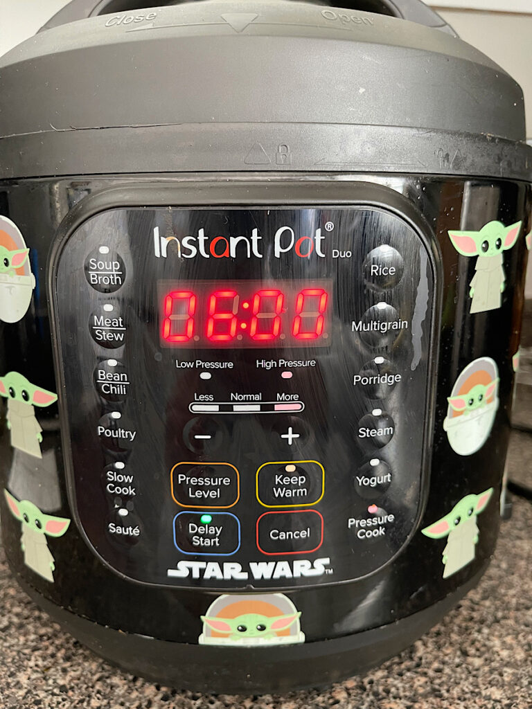 An instant pot set to delay start for overnight steel cut oatmeal.