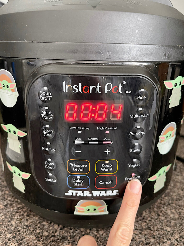 An instant pot set to pressure cook on high for 4 minutes to make steel cut oats.