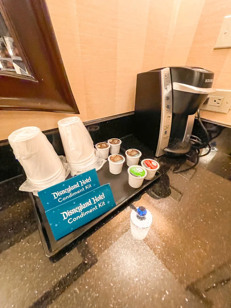 Coffee maker and complimentary coffee pods inside a room at the Disneyland Hotel.