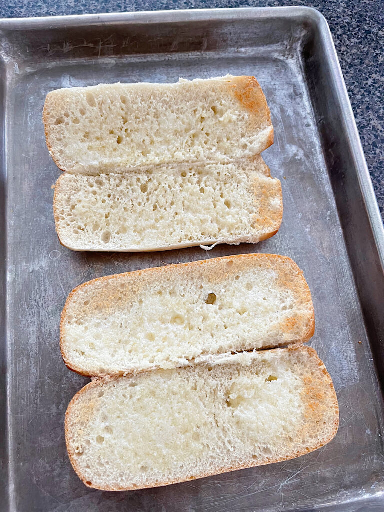 Toasted bread on a baking sheet.