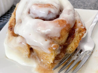 A TikTok cinnamon roll made with heavy cream and extra frosting.