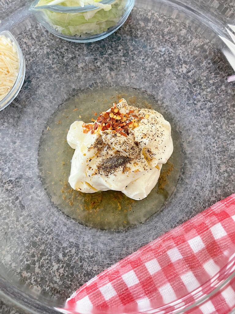 Grinder salad dressing ingredients in a bowl.