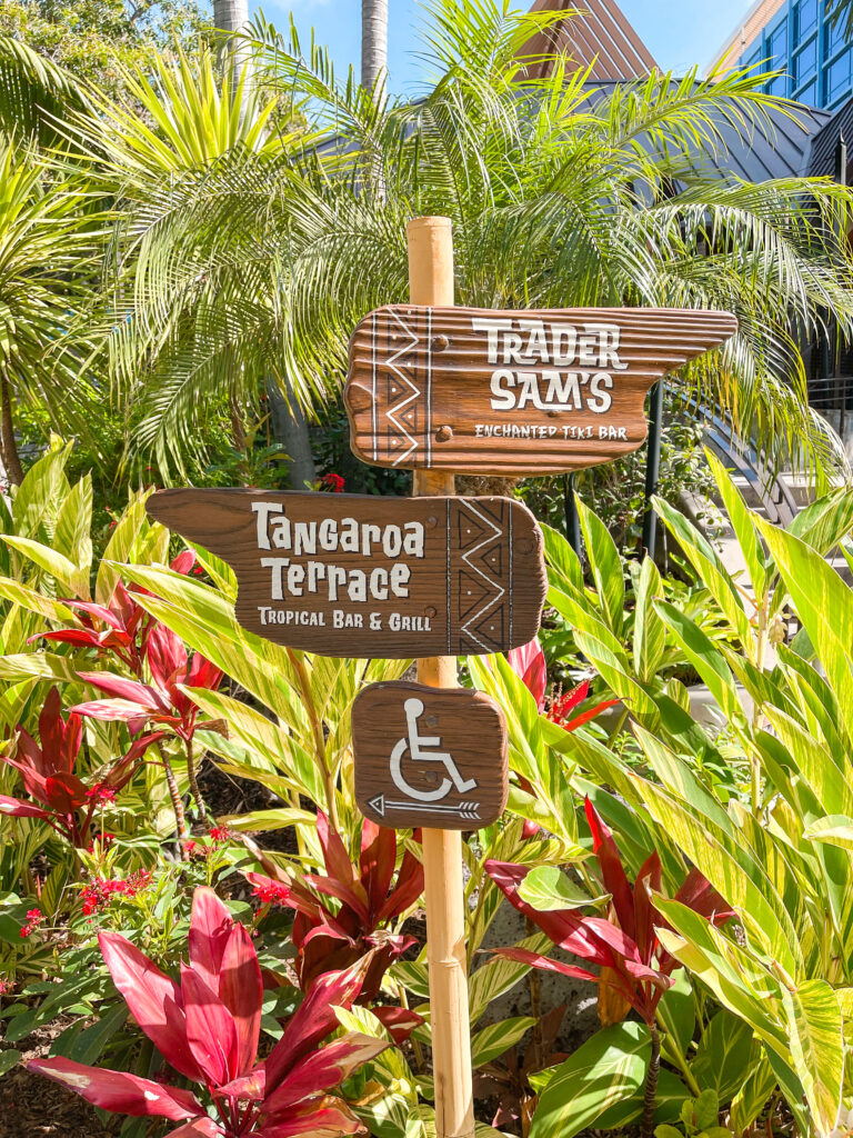 A sign at the Disneyland Hotel showing How to Get to Trader Sam's and Tangaroa Terrace.