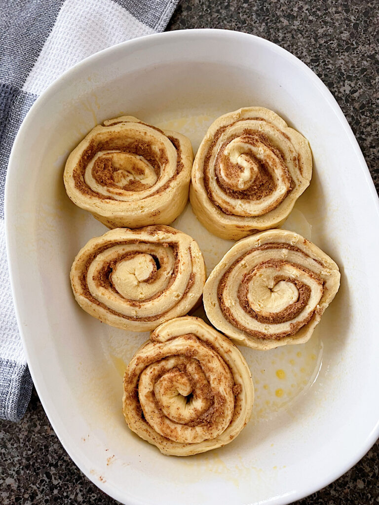 Pillsbury cinnamon rolls in a baking dish.