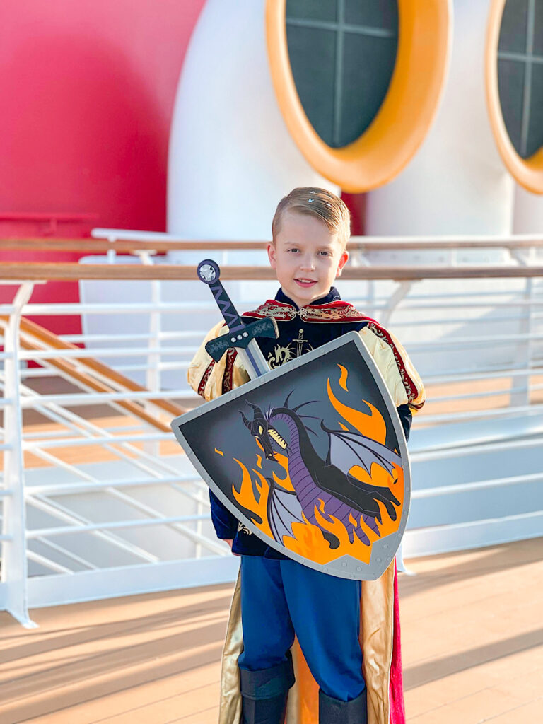 A boy in a prince or knight costume from the Bibbidi Bobbidi Boutique on the Disney Magic.