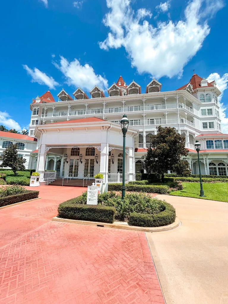 Disney's Grand Floridian main building that is white with a red roof.