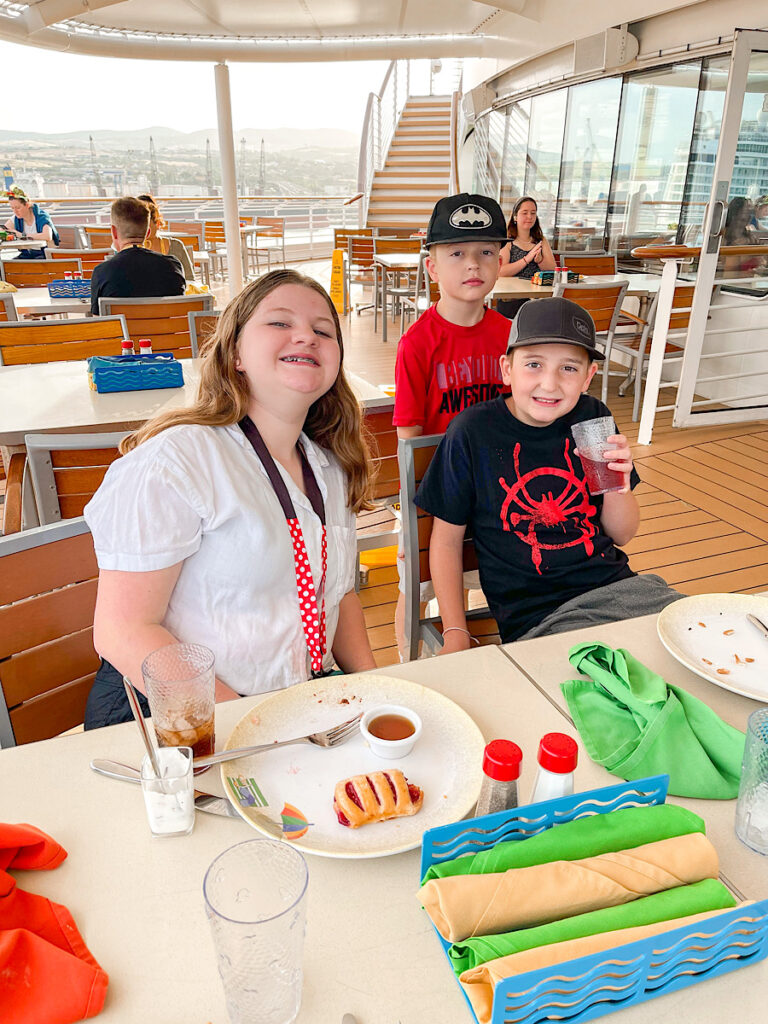 Three kids eating breakfast at Cabanas on the Disney Magic.