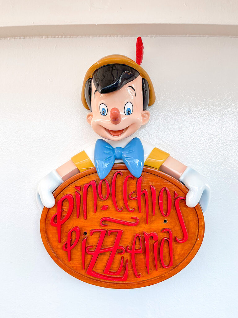 Sign for Pinocchio's Pizzeria on the Disney Magic.