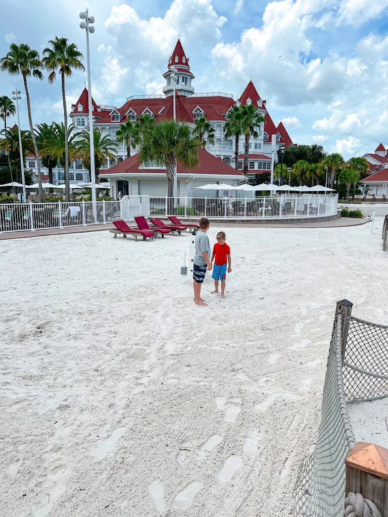 Two kids on the beach at Disney's Grand Floridian.