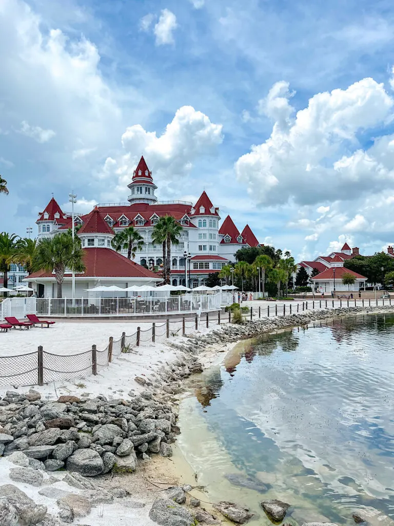 Disney's Grand Floridian Resort next to a lake.