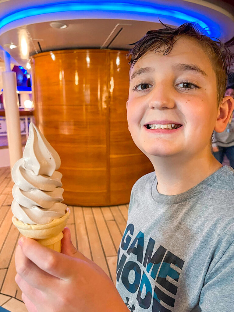 A child with an ice cream cone on the Disney Magic.