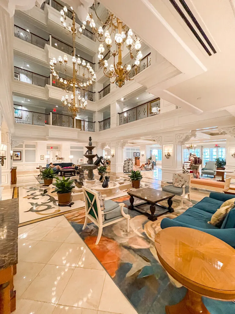 A large chandelier and fountain in the lobby of Disney's Grand Floridian villas.