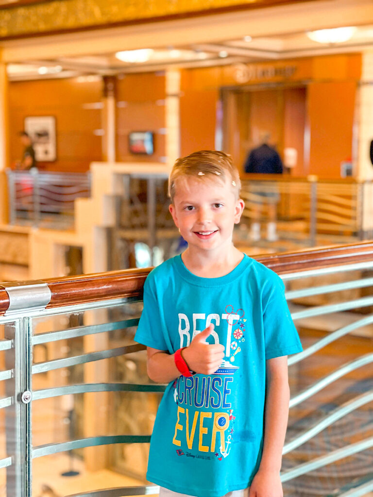 A boy in a new shirt on the Disney Cruise.