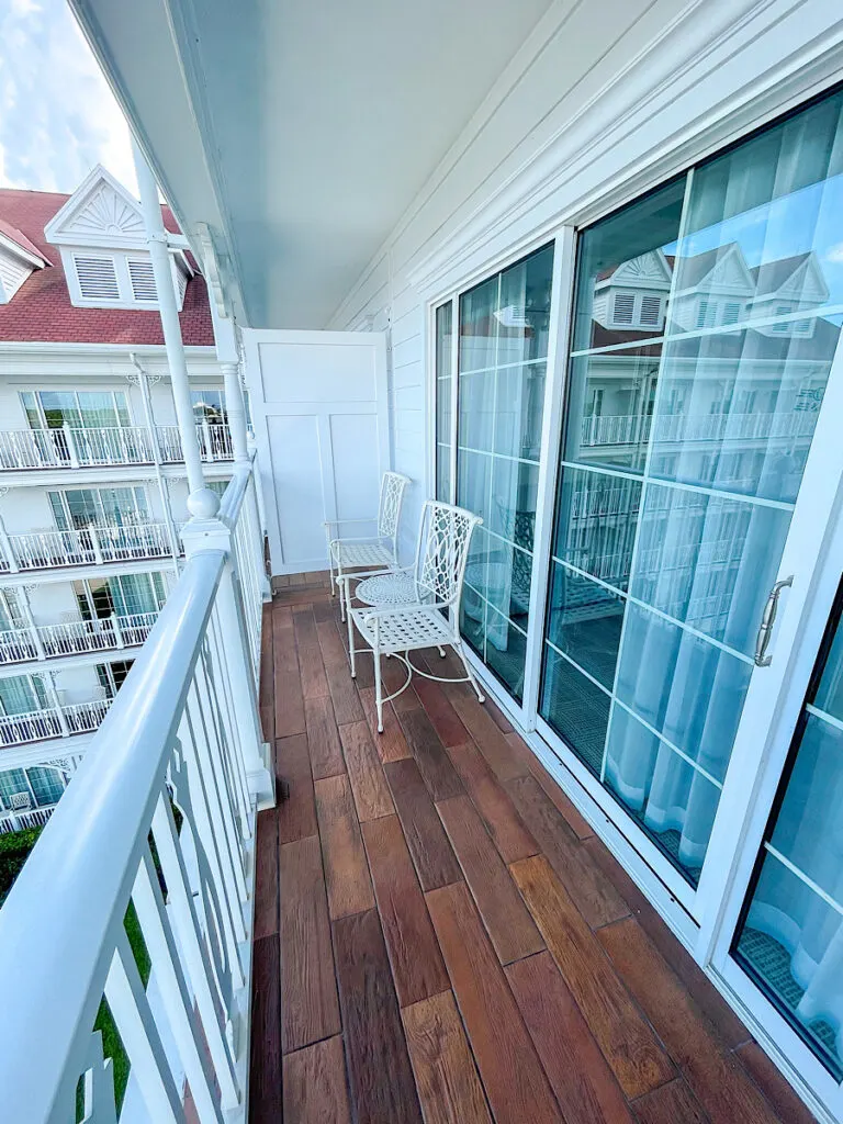 Grand Floridian Balcony with two chairs and a small table.