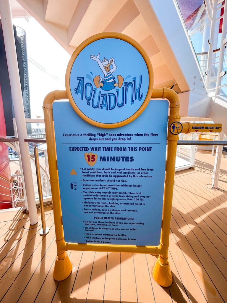 Rules for riding the AquaDunk water slide on the Disney Magic.