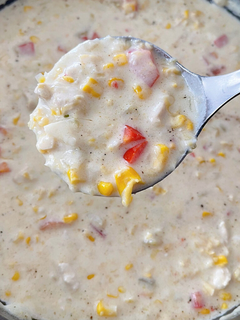 Mexican corn chowder in a ladle.