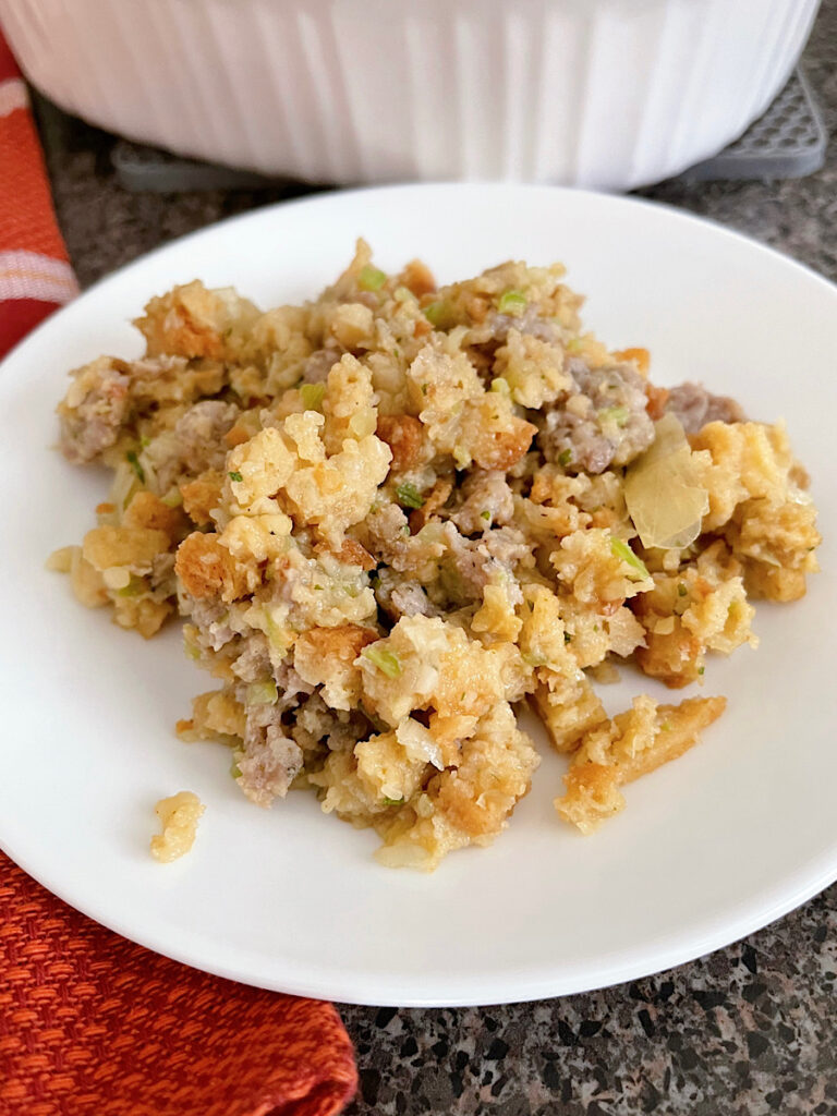 Thanksgiving Stove Top Stuffing with sausage in a white baking dish.