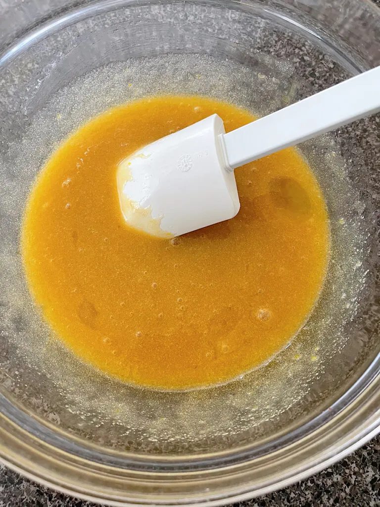 Wet ingredients in a mixing bowl for Cosmic Brownies.