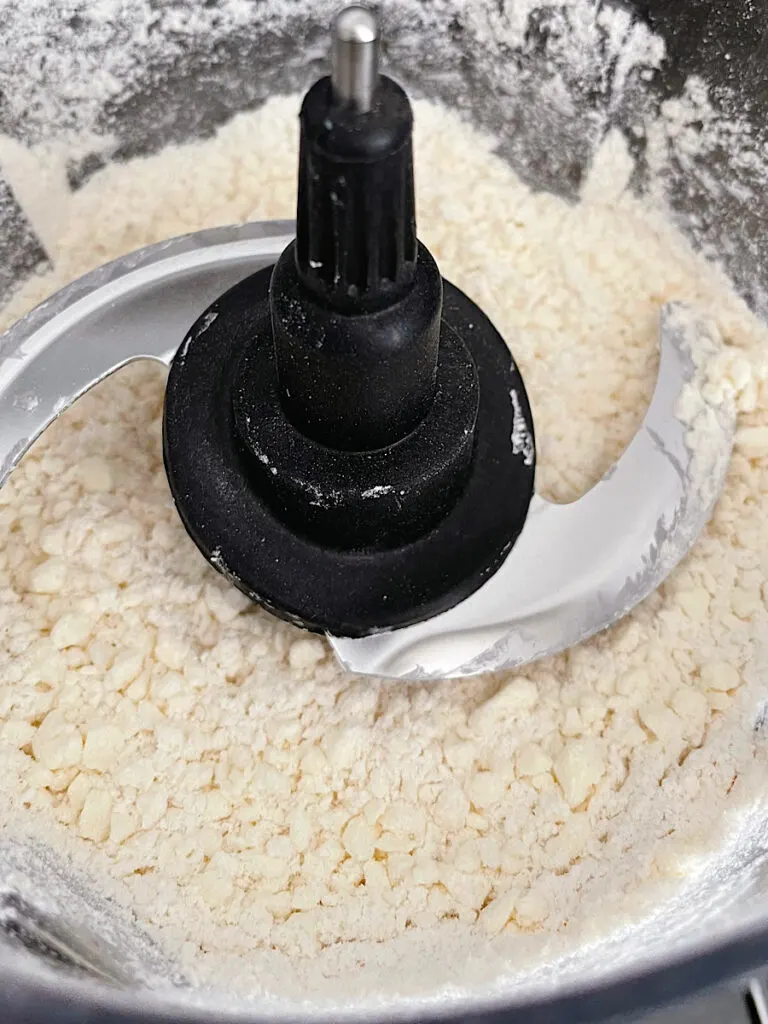 Pie crust ingredients in a food processor.