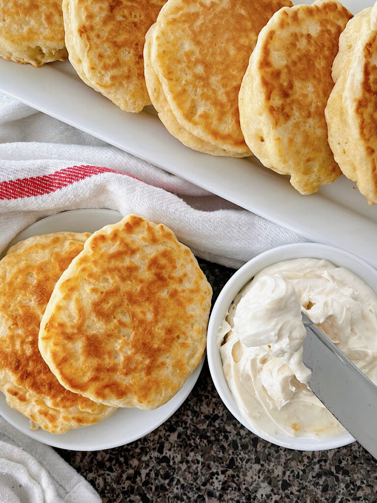 The Queen's favorite dropped scones next to a dish of whipped honey butter.