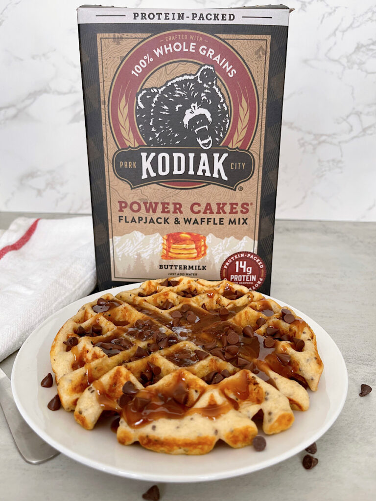 A Kodiak Protein Waffle drizzled with peanut butter syrup and mini chocolate chips.