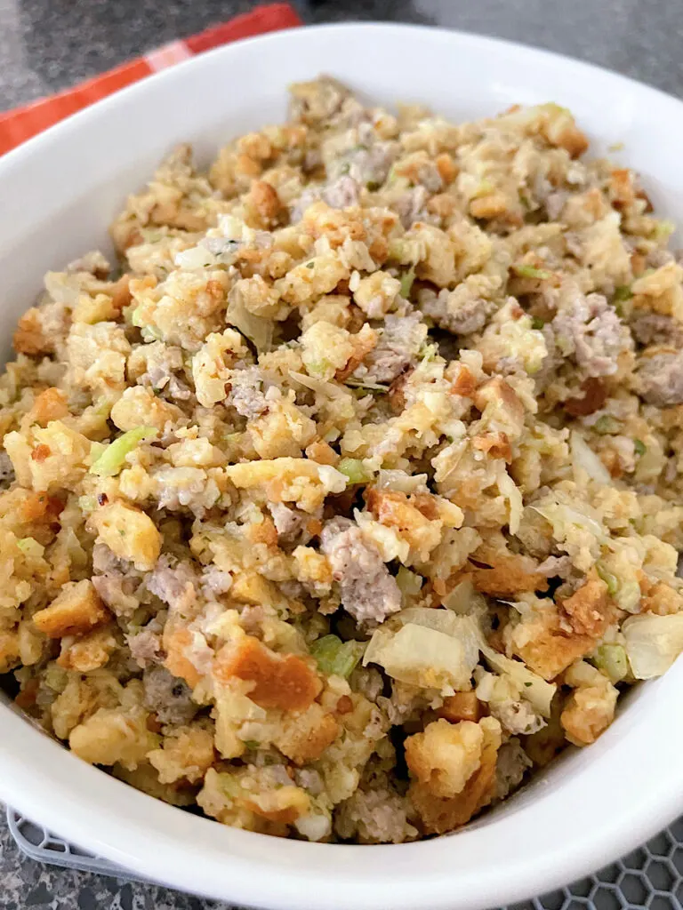 Thanksgiving Stove Top Stuffing with sausage in a white baking dish.